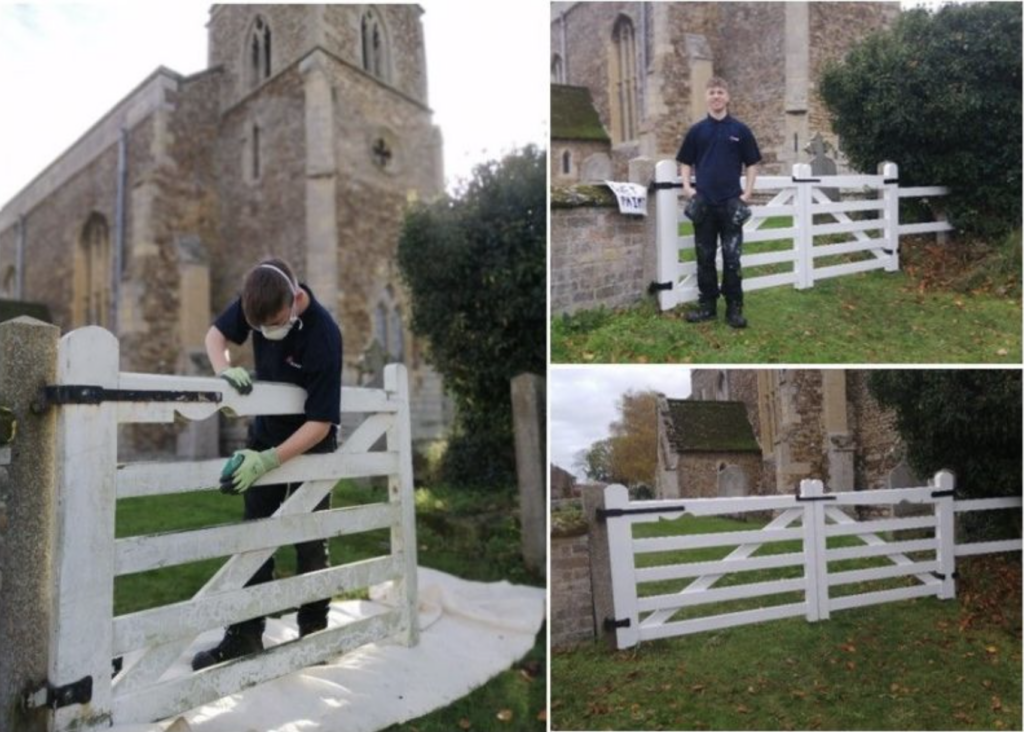 GSH employee cleaning fence at historic building