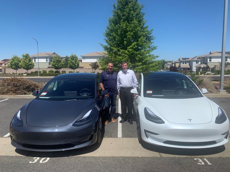 Black and white teslas with GSH employees